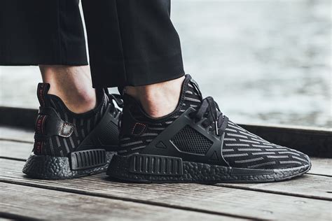 adidas nmd xr1 triple black fake|are nmd shoes real.